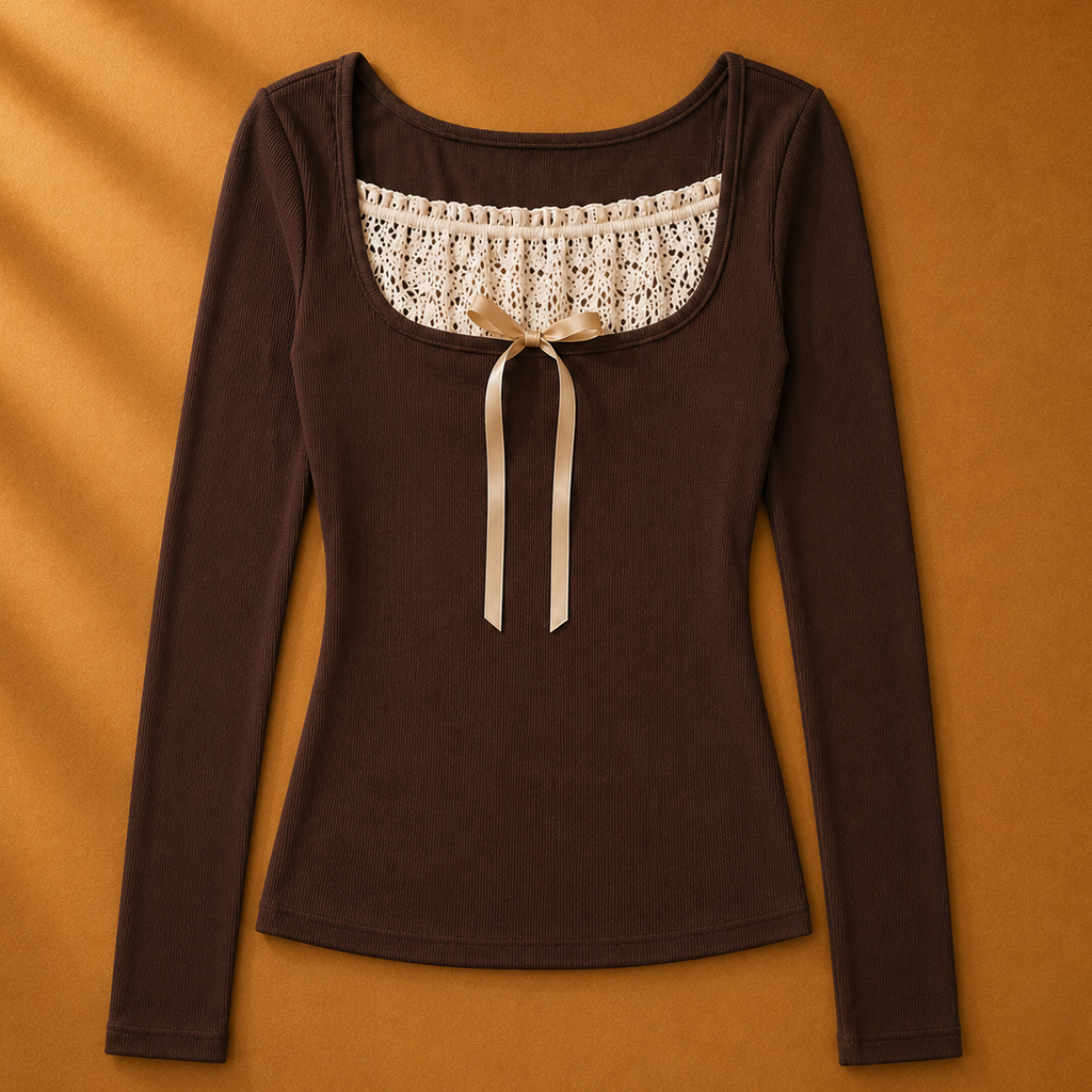 Brown long-sleeve top with lace neckline and bow on a brown background