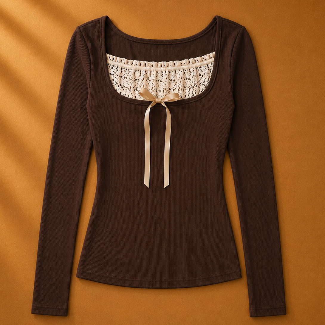 Brown long-sleeve top with lace neckline and bow on a brown background