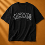Black t-shirt with 'YAHWEH THE GREAT I AM' text on a brown background